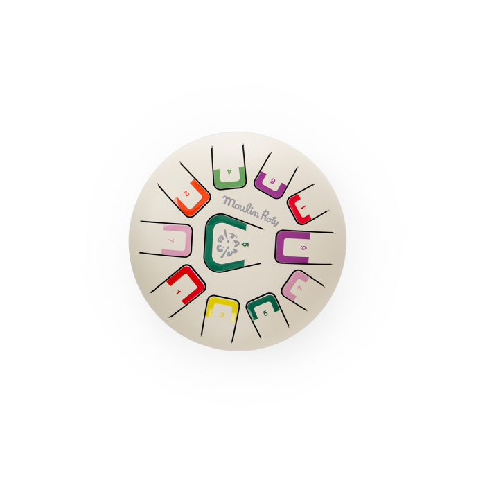 Tongue drum top view with colorful rectangular note tongues on white body