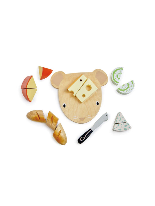 Wooden cow-shaped cheese chopping board with sliced pieces and toy knife
