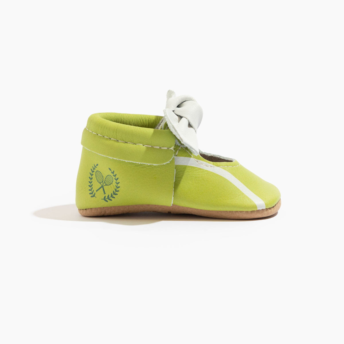 Lime green baby shoe with white knotted bow and laurel detail