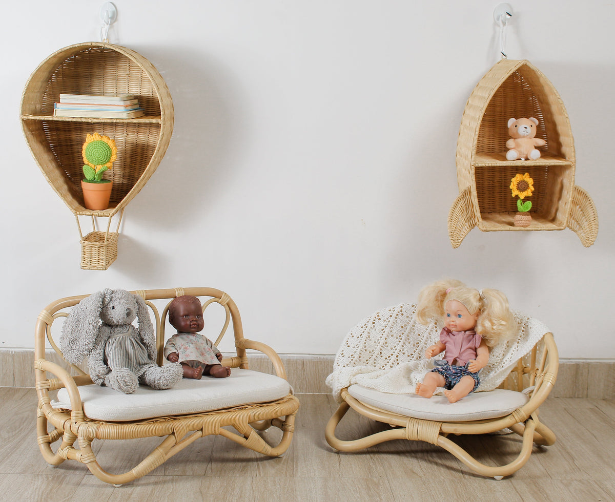 Natural rattan miniature doll couch with white cushion and low curved base