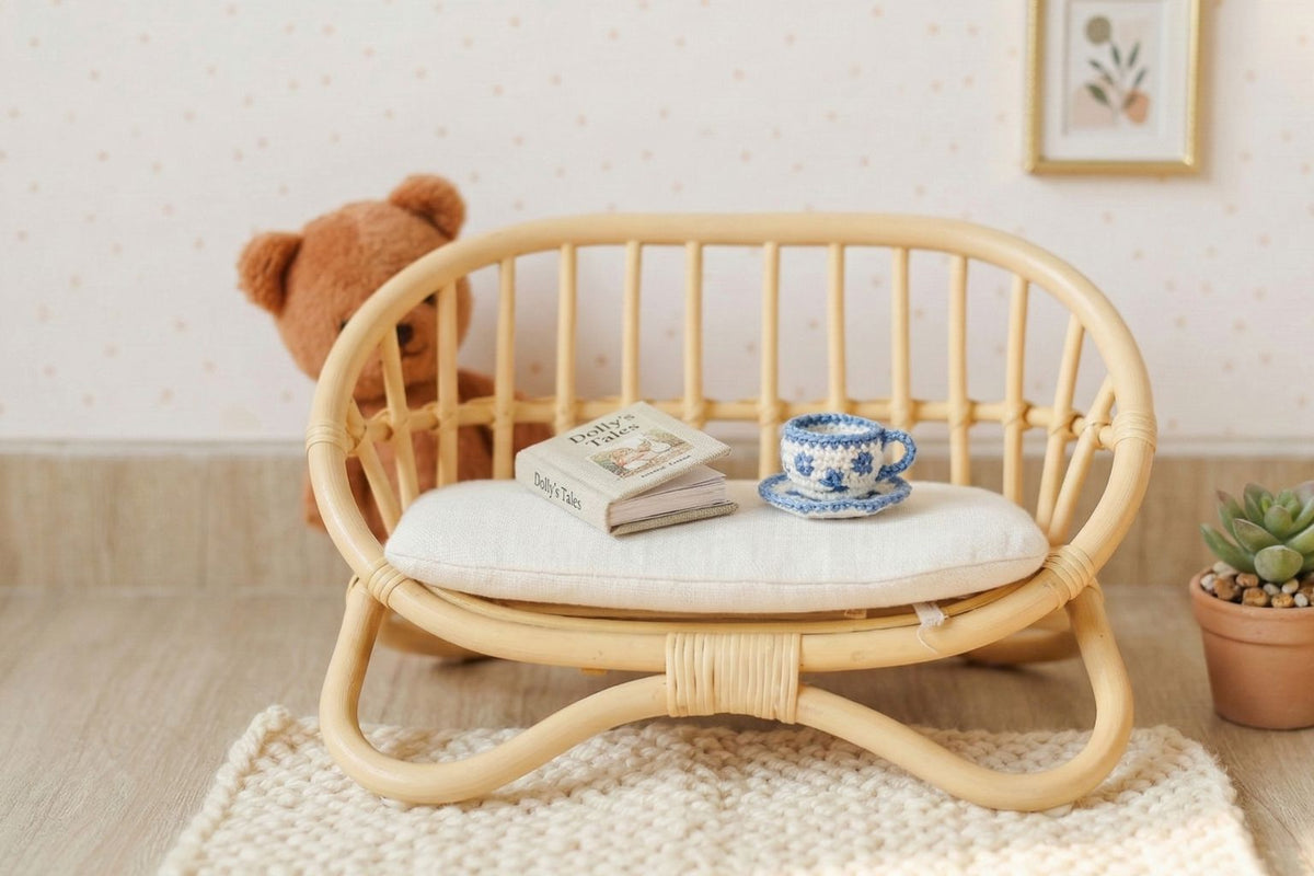 Natural rattan miniature doll couch with white cushion and curved slatted back