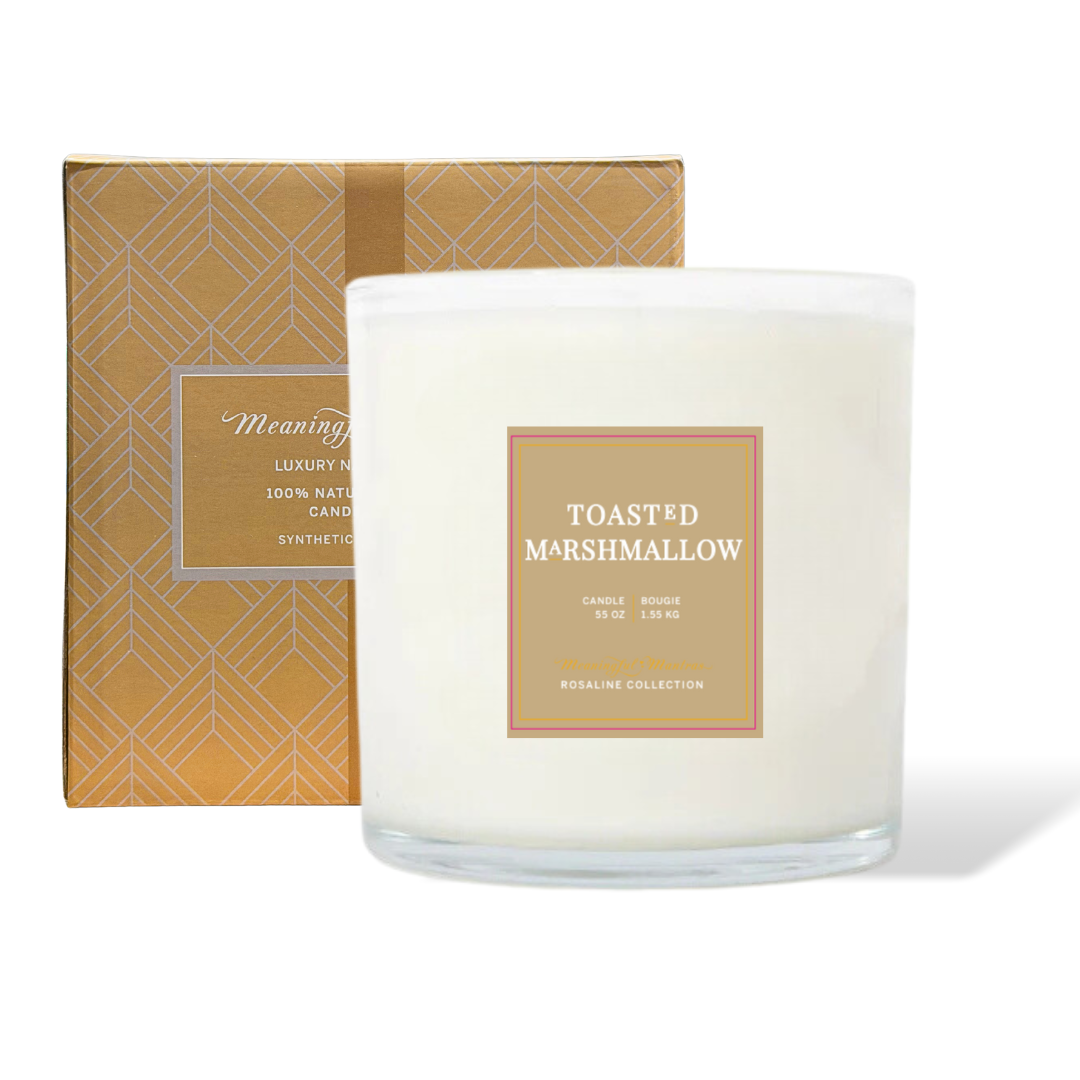 Toasted Marshmallow candle in a clear glass jar with a tan label and patterned box