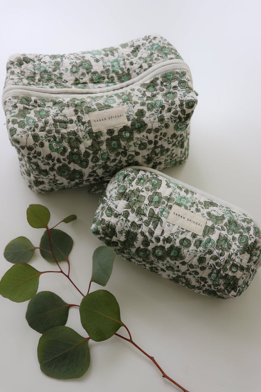 Olive floral toiletry bag set with two quilted zip pouches in different sizes.