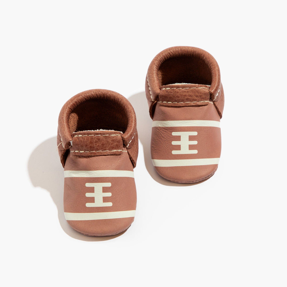 Brown baby soft-sole shoes with H emblem and hook-and-loop strap, front view