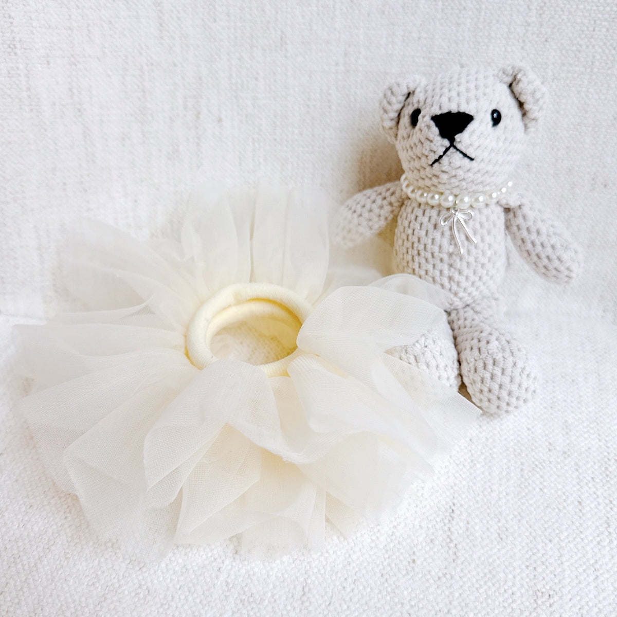 Bear bag charm with cream tulle scrunch tutu and pearl necklace