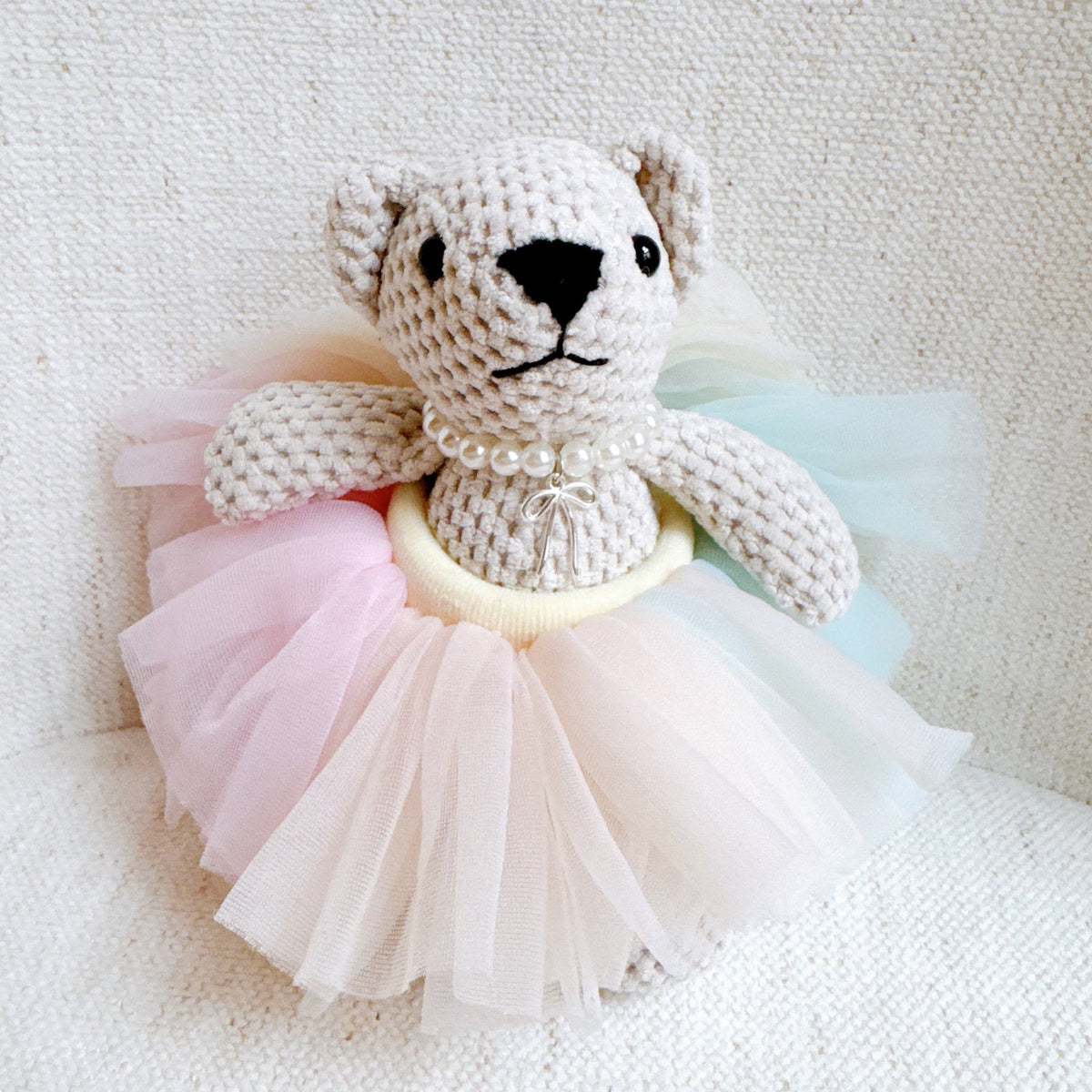 Bear bag charm with pale pink tulle scrunch tutu and pearl collar