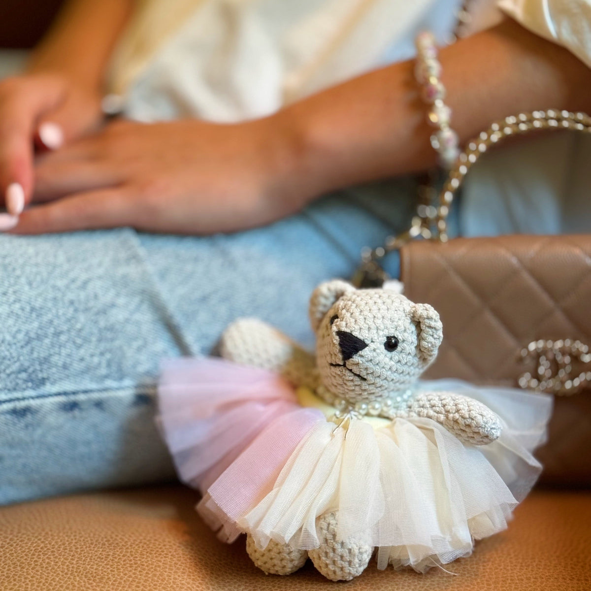 Bear bag charm with pale pink layered tutu, pearl collar and crochet bear