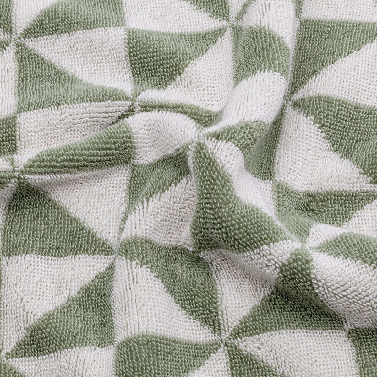 Sage green and ecru geometric check towel fabric close-up