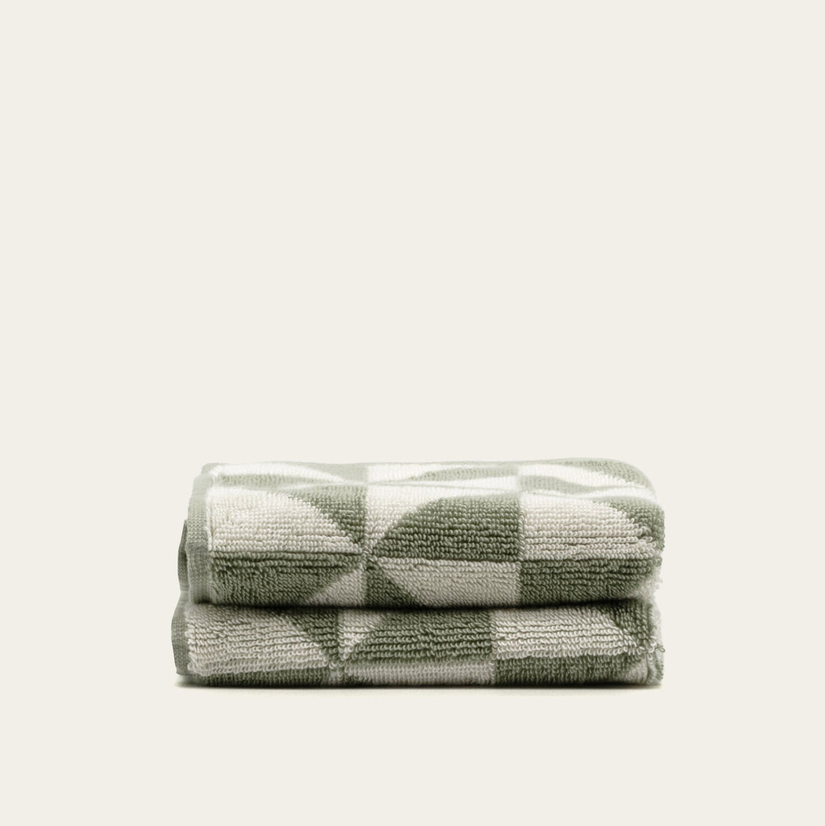Sage green and ecru geometric check cotton towels, folded stack