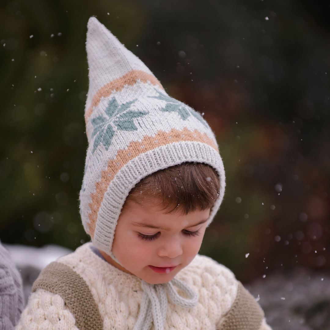 Gray knit pixie hat with orange and mint diamond Nordic pattern