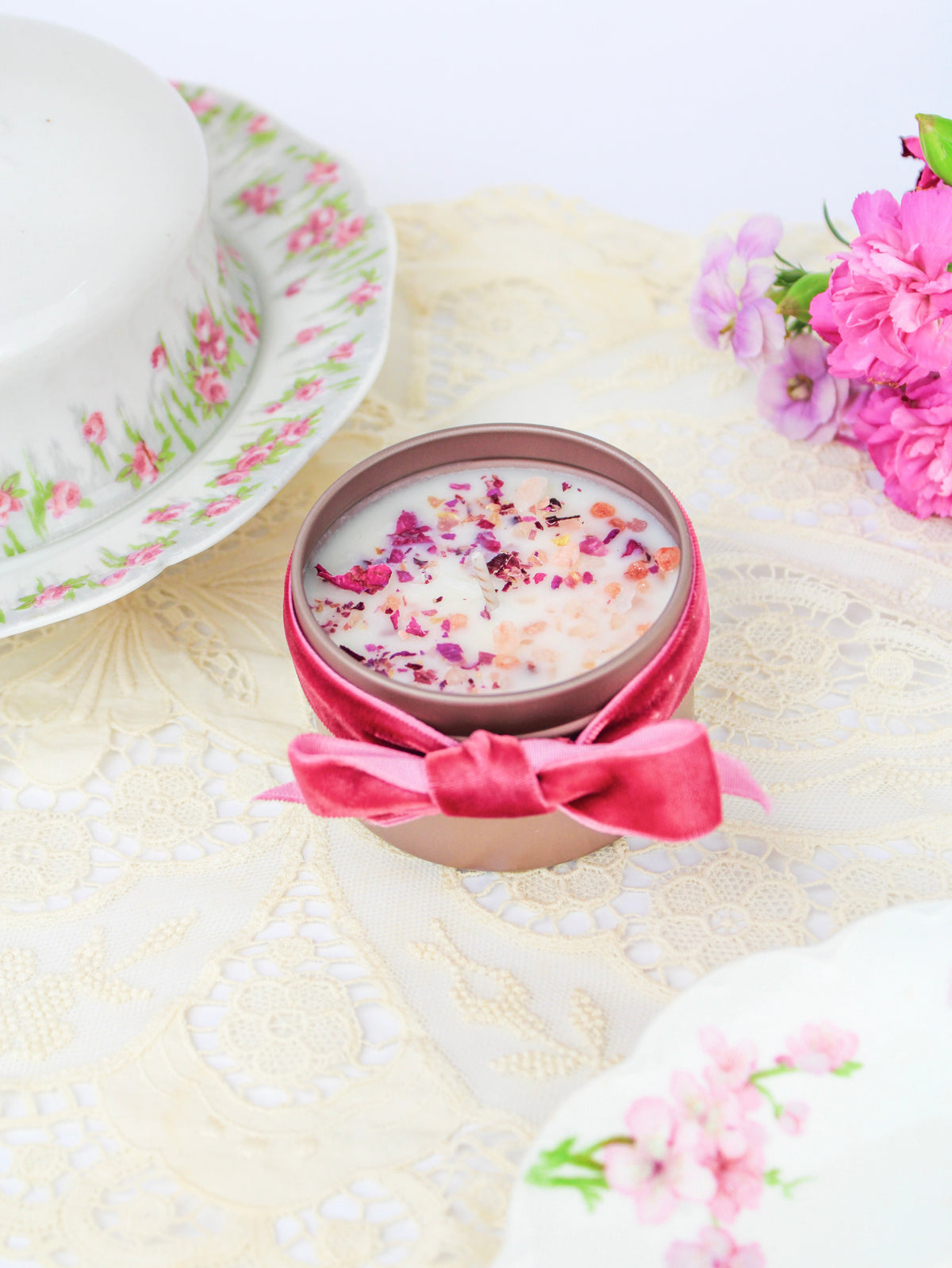 Botanical soy wax candle in rose-gold tin with velvet pink bow and dried flower wax