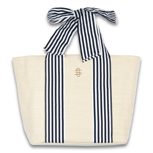 Simply Southern® cream tote with navy vertical stripes, gold emblem, bow top