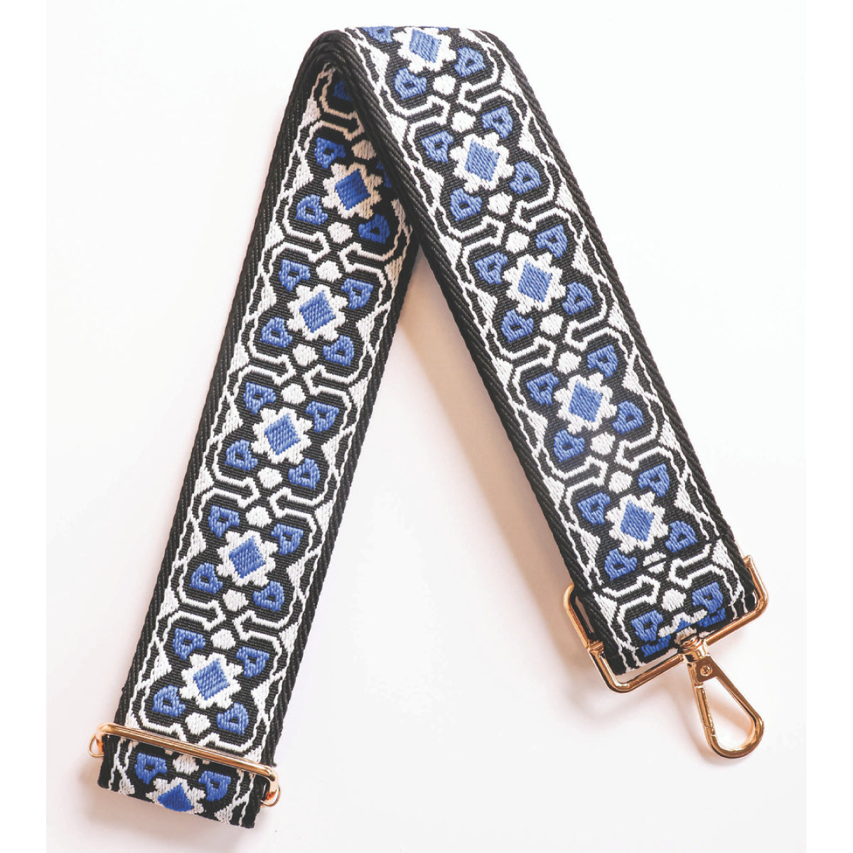 Adjustable purse strap with blue geometric pattern and gold end clips