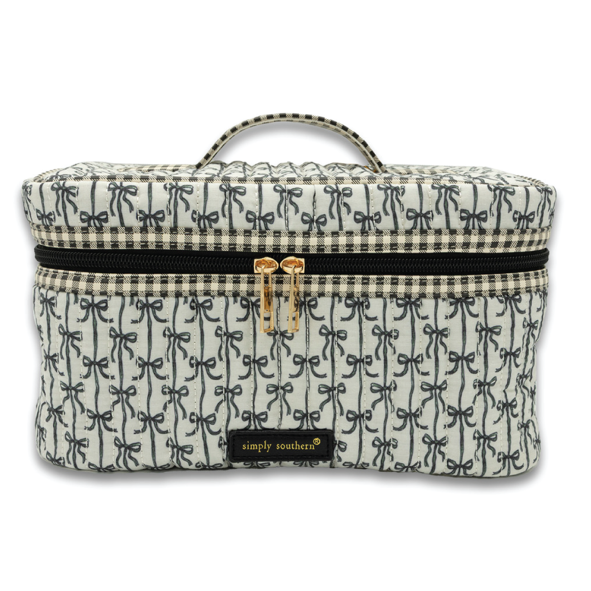 Quilted train case with dark blue patterned fabric and zip closure, top handle