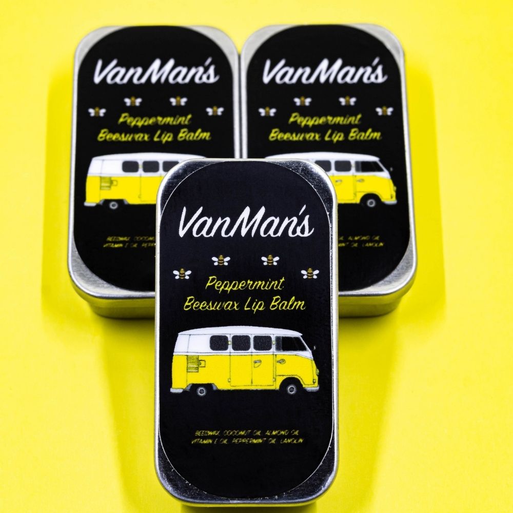 Peppermint beeswax lip balm tins, yellow bus graphics on black lids