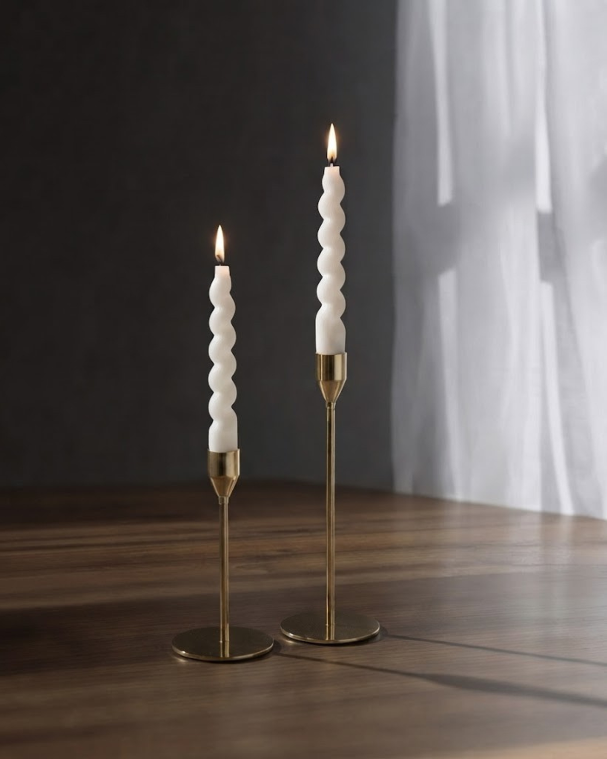Swirl taper candle set with spiral white candles on two gold-tone stands