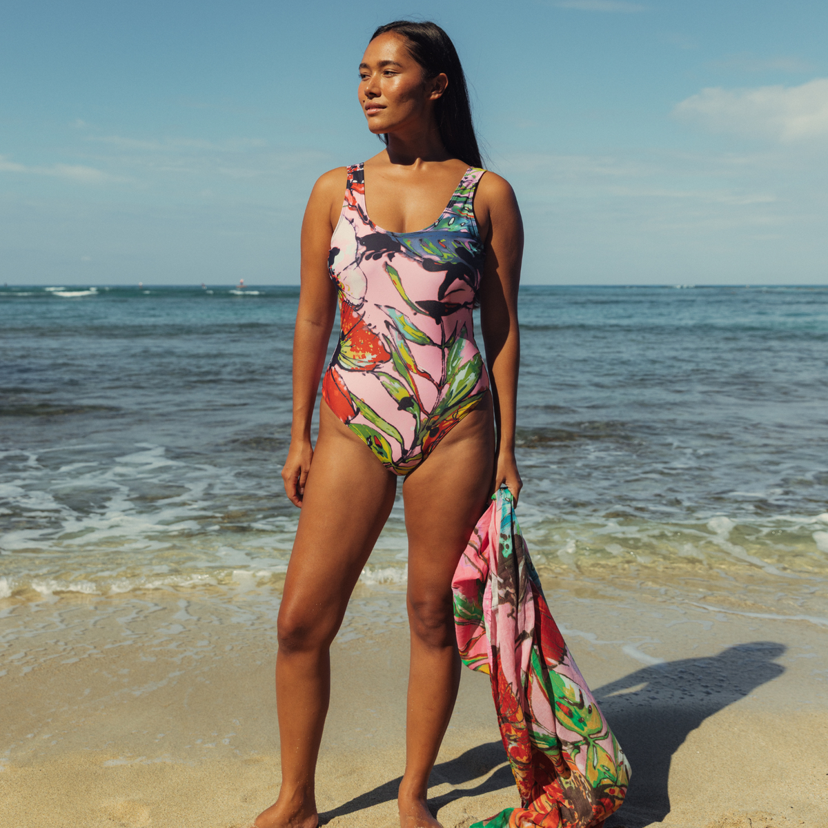 Women's one-piece swimsuit with scoop neckline and colorful abstract floral print
