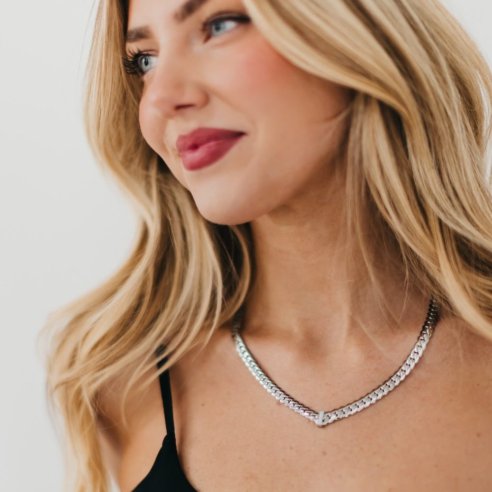 Silver diamond V necklace on model with chain and V-shaped pendant