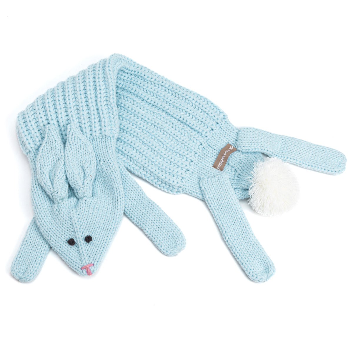 Pale blue knitted rabbit scarf laid flat, showing its long ends and pom-pom tail