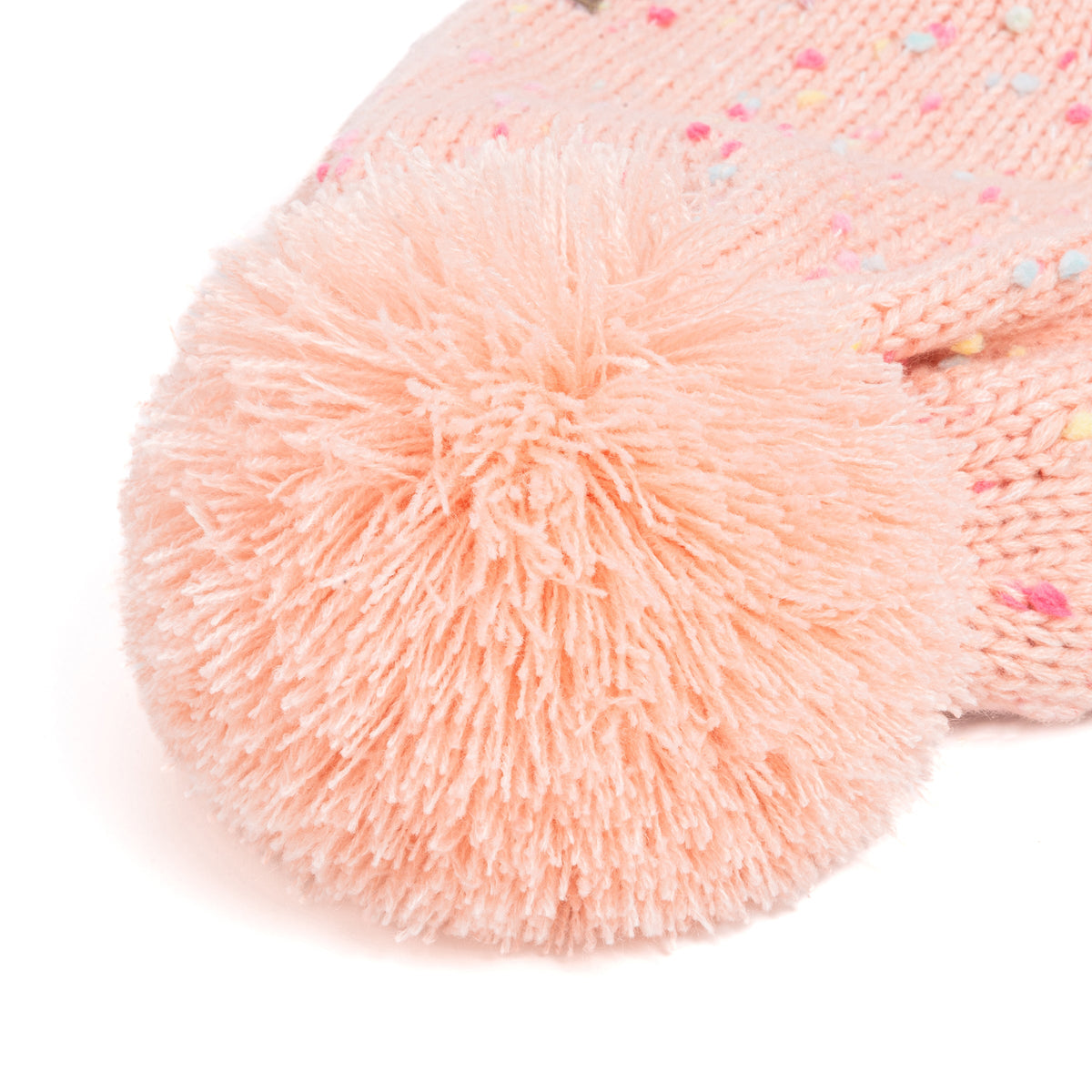 Close-up of fluffy pom-pom on a coral-pink flecked knit hat