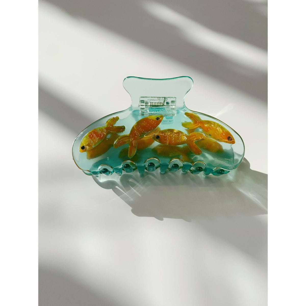 Goldfish hair claw clip, teal transparent shell with orange fish and center clasp