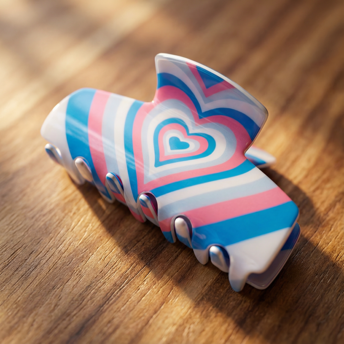 Blue heart-striped hair claw clip with rounded teeth