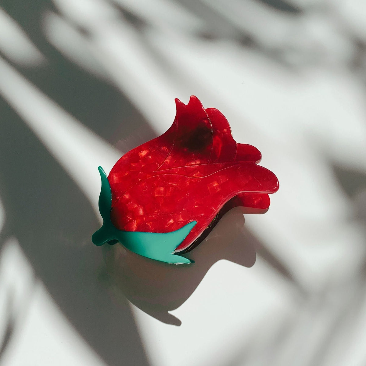 Red rosebud hair claw clip with green leaves, small claw shape