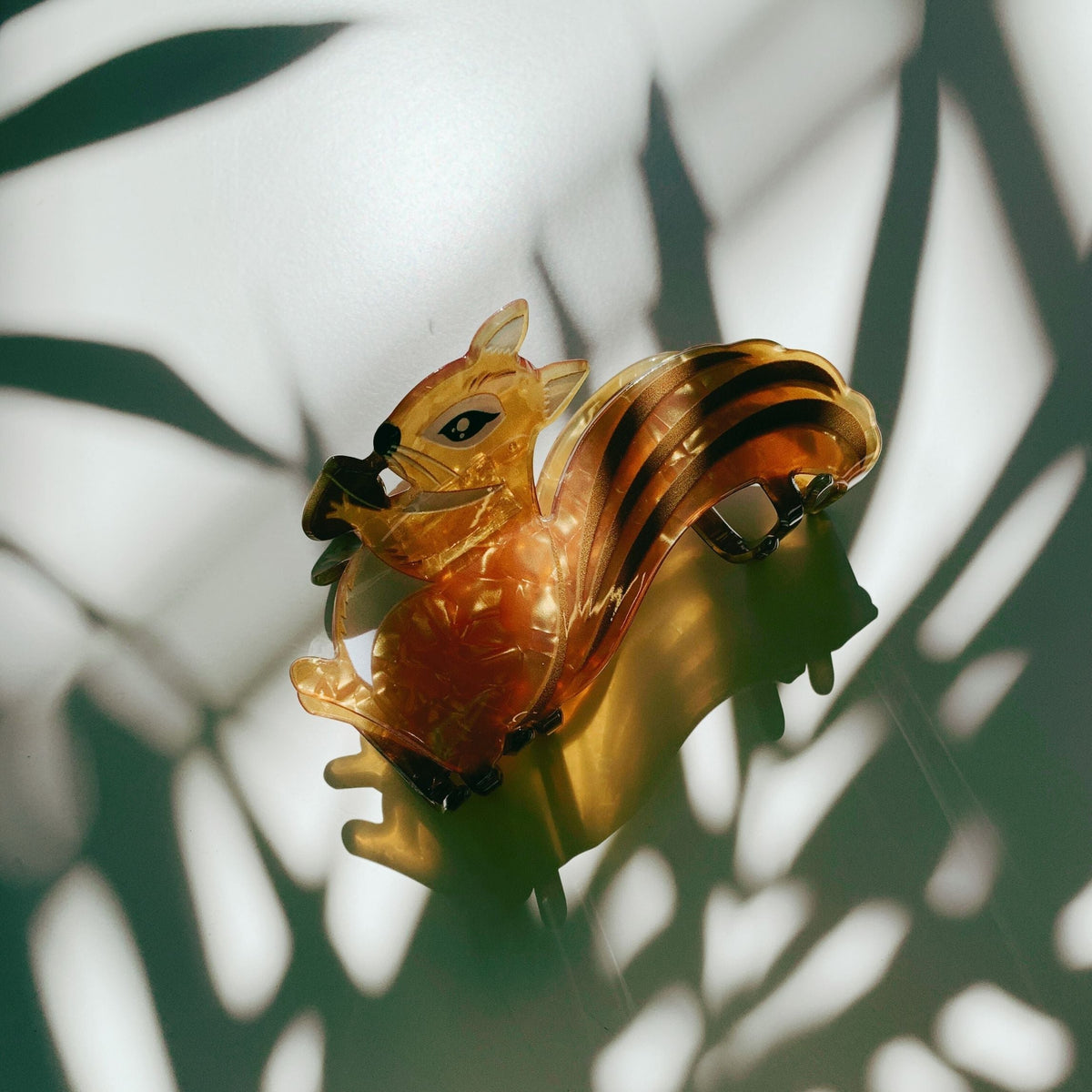 Amber squirrel hair claw with layered stripes and metal side prongs