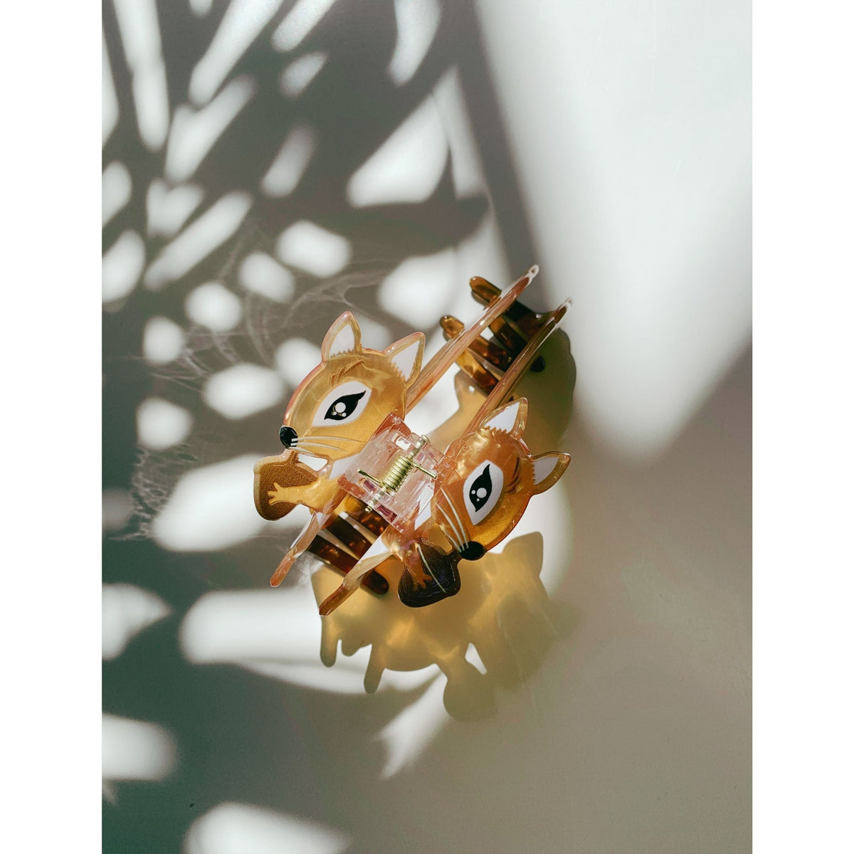 Amber squirrel hair claw set of two figures with curved metal ends