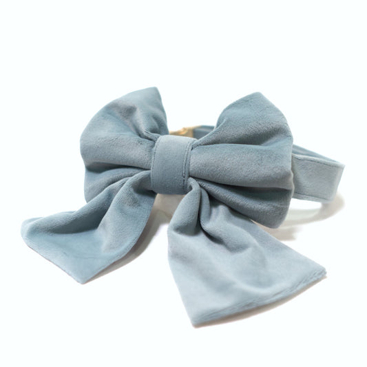 Light blue velvet dog collar with large sailor bow, knotted center