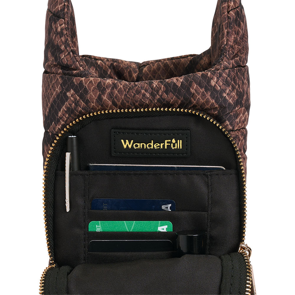 Snake-print HydroBag interior pocket with “WanderFull” patch and card slots