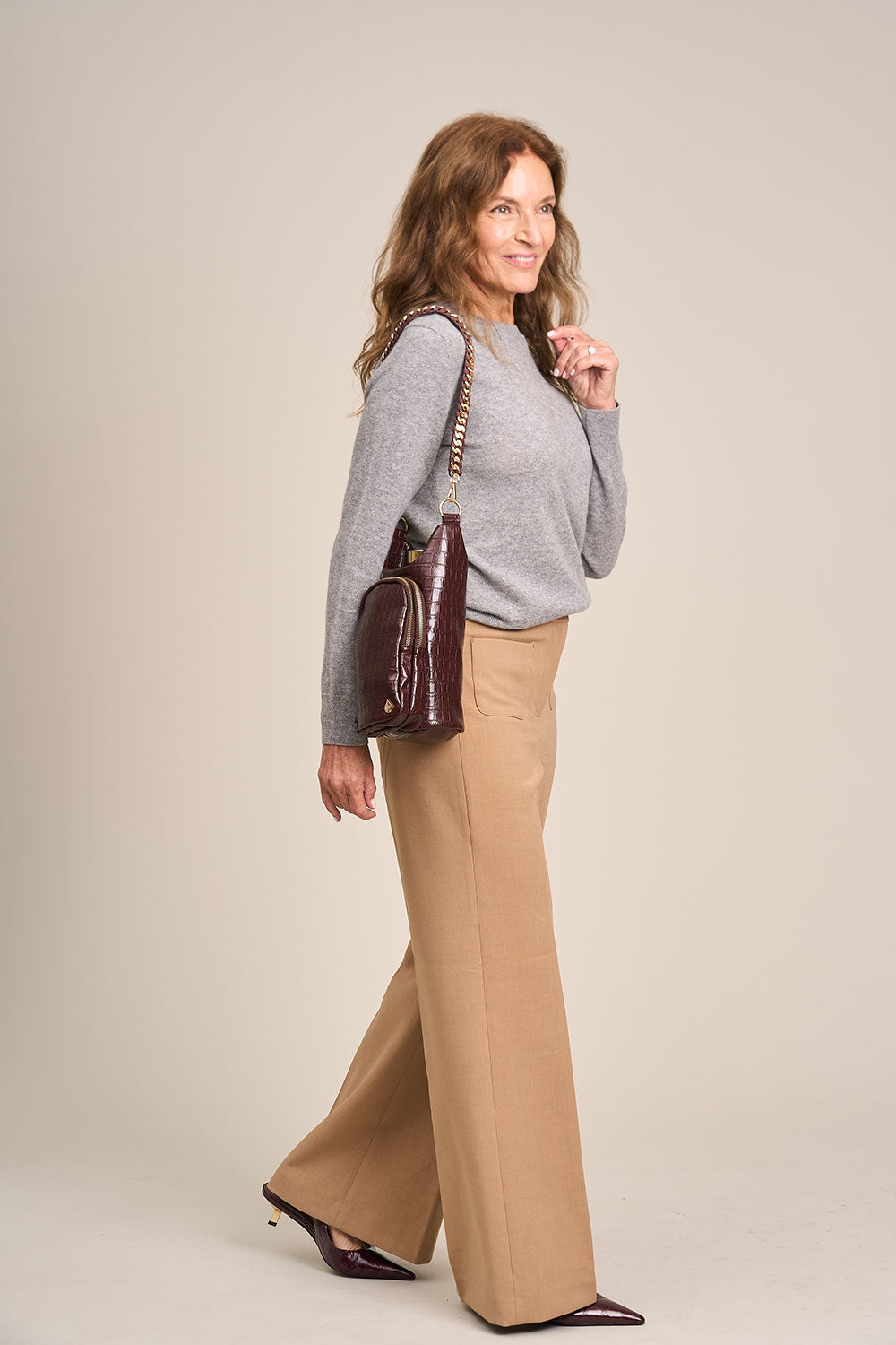 Merlot faux croc HydroBag shoulder bag worn with chain strap, gold hardware and tassel