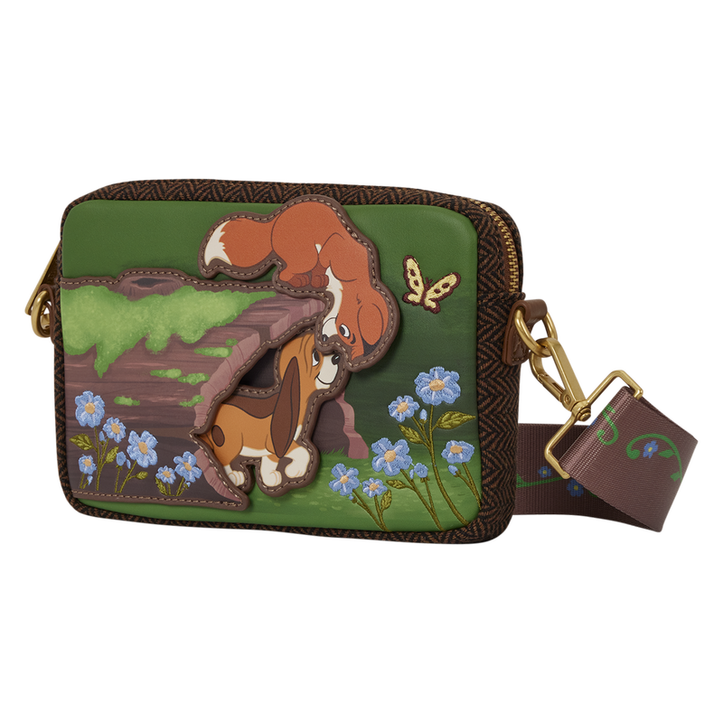 Green sling bag with layered Fox and the Hound artwork, blue flowers, and brown trim