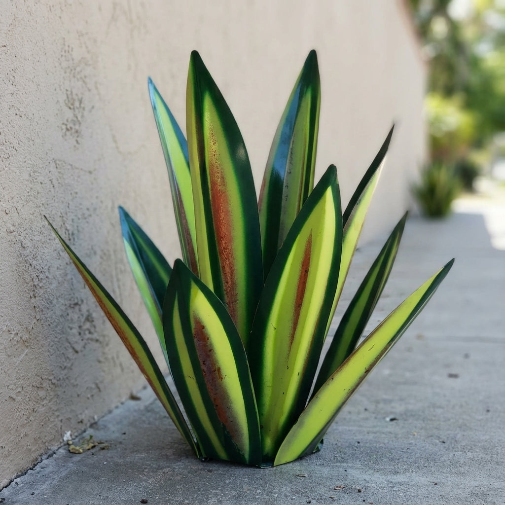 Metal agave garden sculpture with layered green and yellow leaves edged in dark green