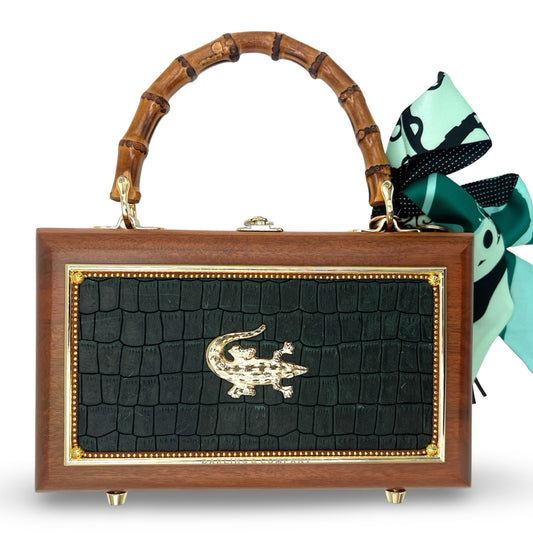 Wooden box handbag with dark green crocodile-look panel and gold front crest