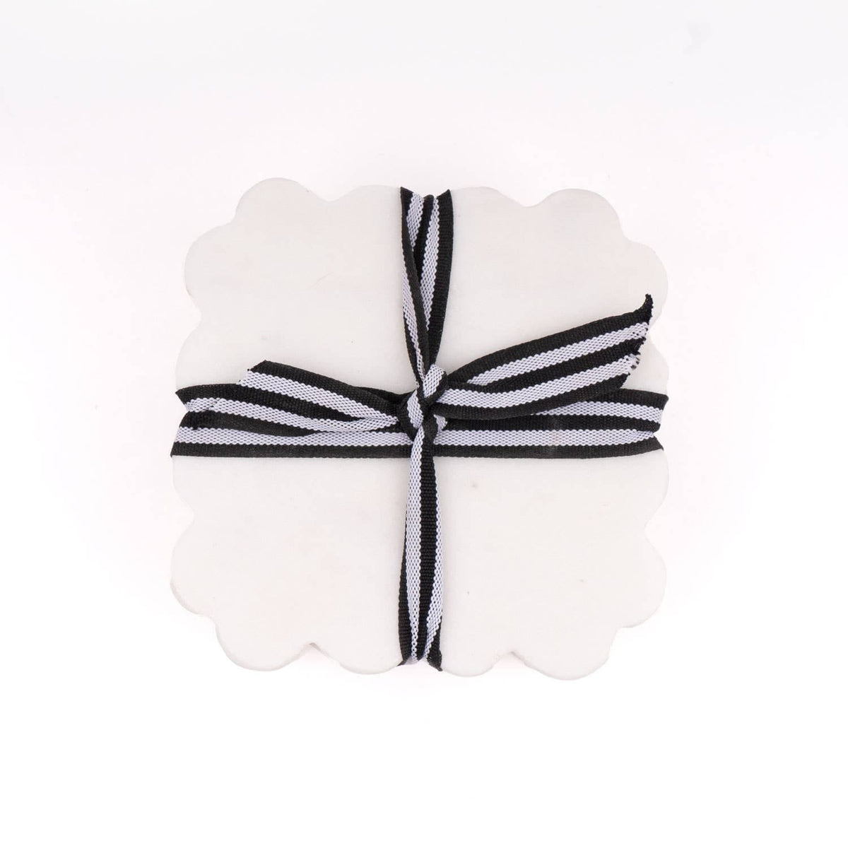 Scalloped white coaster with black-and-white striped ribbon bow
