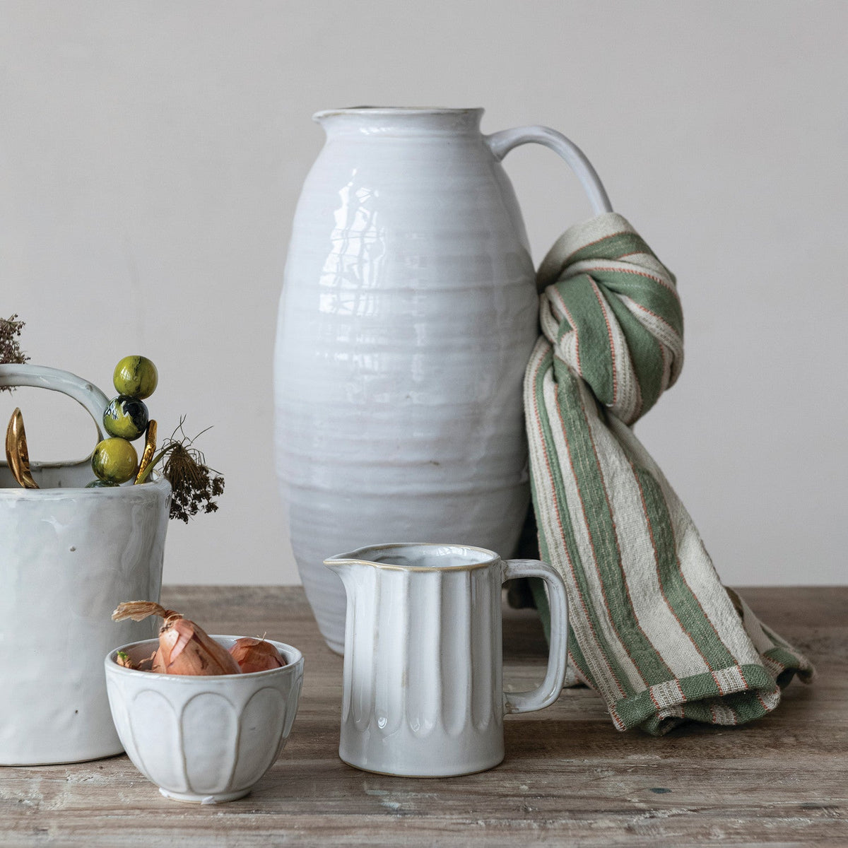 White stoneware pitcher with curved handle and ribbed texture, 3-3/4 qt capacity
