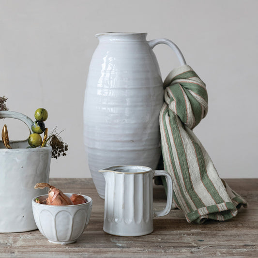 White stoneware pitcher with curved handle and ribbed texture, 3-3/4 qt capacity