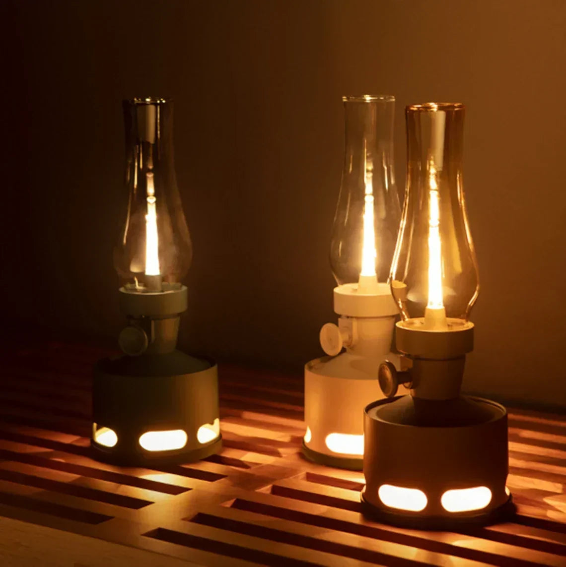 Three rechargeable LED lanterns in dark, light, and brown finishes