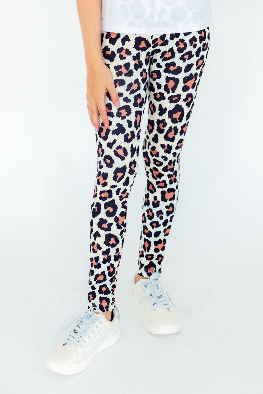 Leopard print leggings with slim fit, cream base and multicolor spots at full length