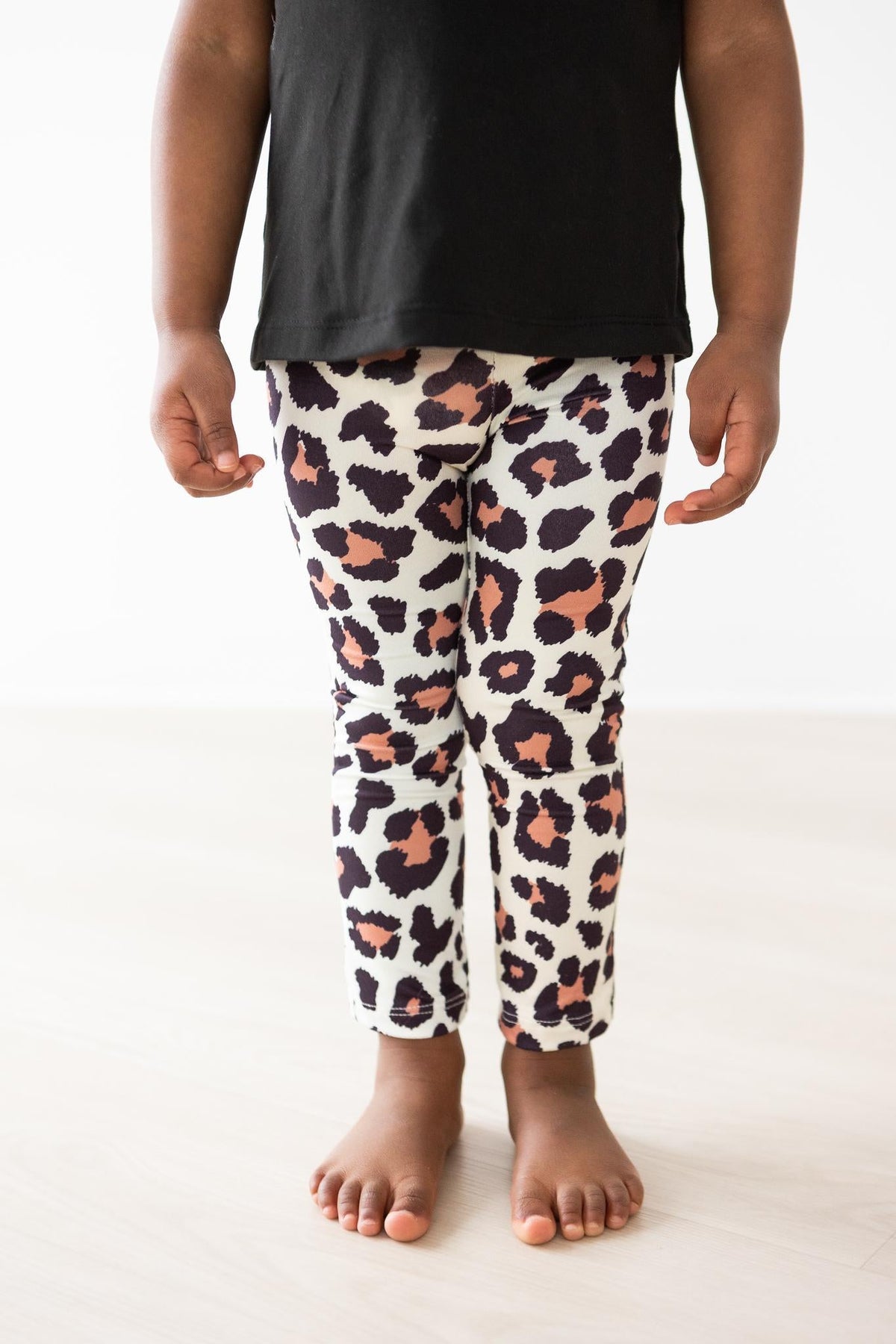 Leopard print leggings, cream with black and orange spots, ankle length