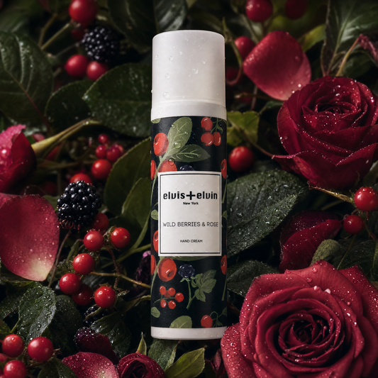 Hand cream bottle with green berry pattern and rose graphics, elvis+elvin label