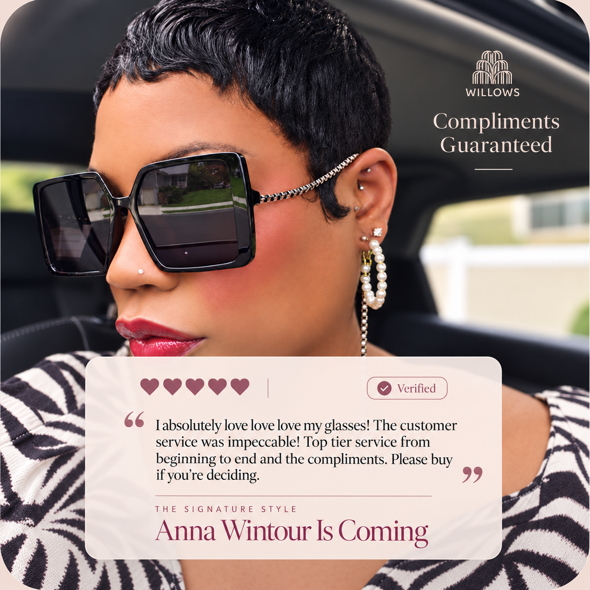 Model wearing black square statement earrings with heart charms and silver-tone chain