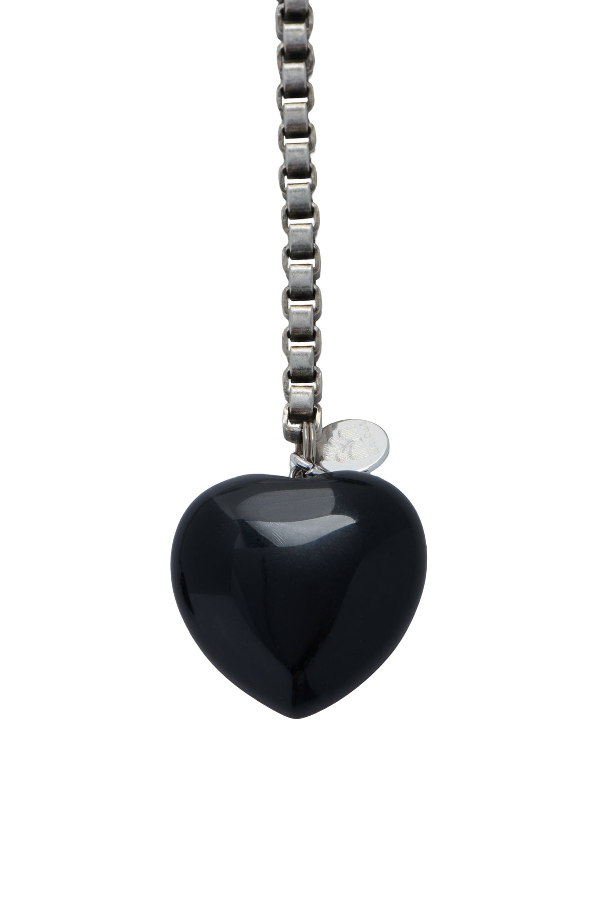 Black heart charm pendant on silver-tone chain with small round tag charm