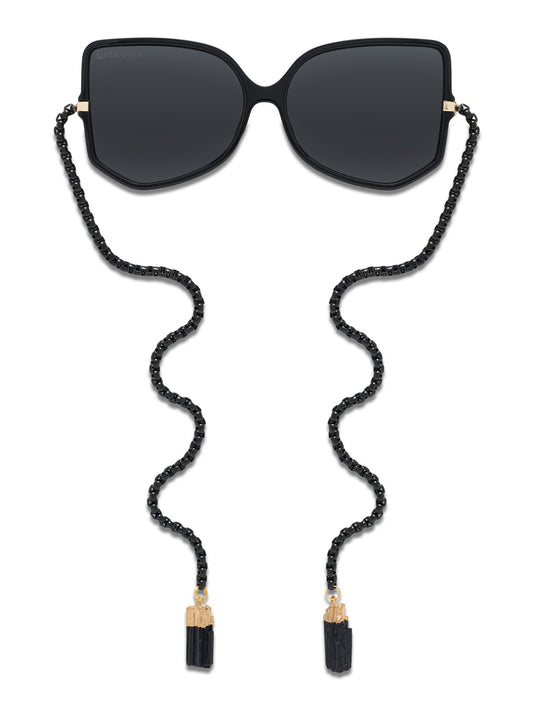 Black sunglasses with dark lenses and black beaded chain cord with gold tips