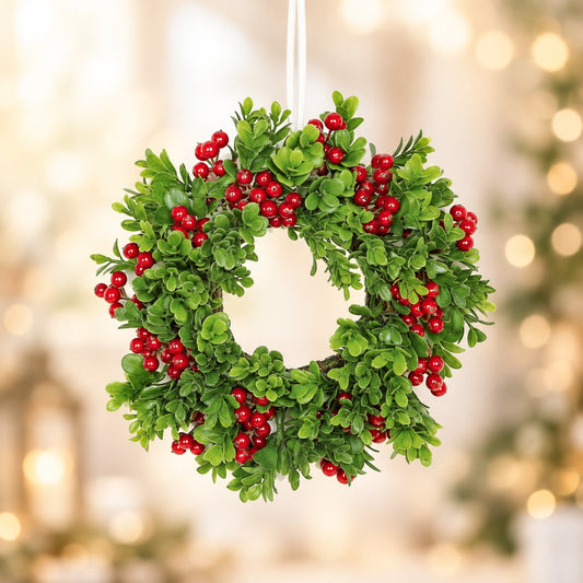 Boxwood and red berry table wreath with dense green leaves and small red berries