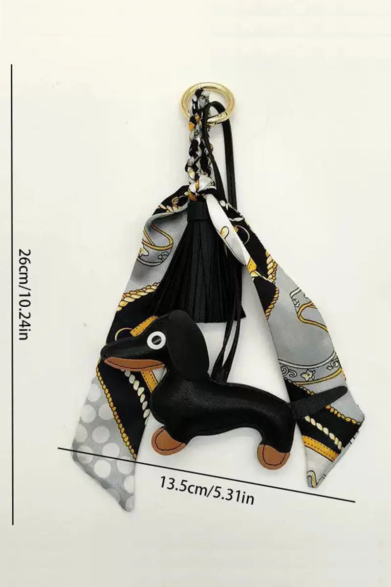 Fringed dachshund leather bag charm, black tassel and scarf ring, with size markings