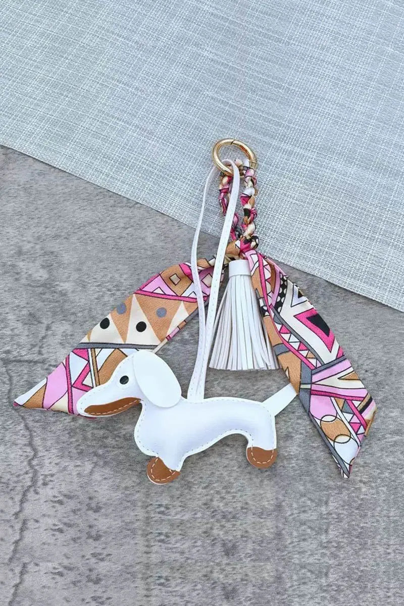 Dachshund leather bag charm with light blue dog and white tassel, patterned scarf ring