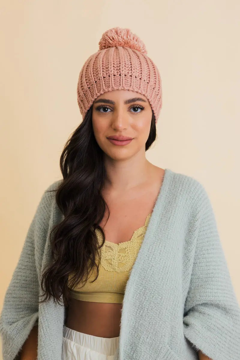 Blush pink chunky cable knit pom beanie with textured knit and ribbed brim