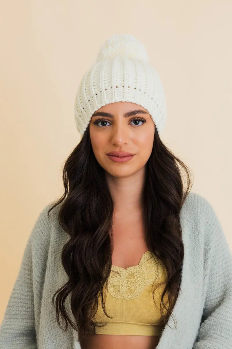 Ivory chunky cable knit pom beanie with soft ribbed brim and pom top